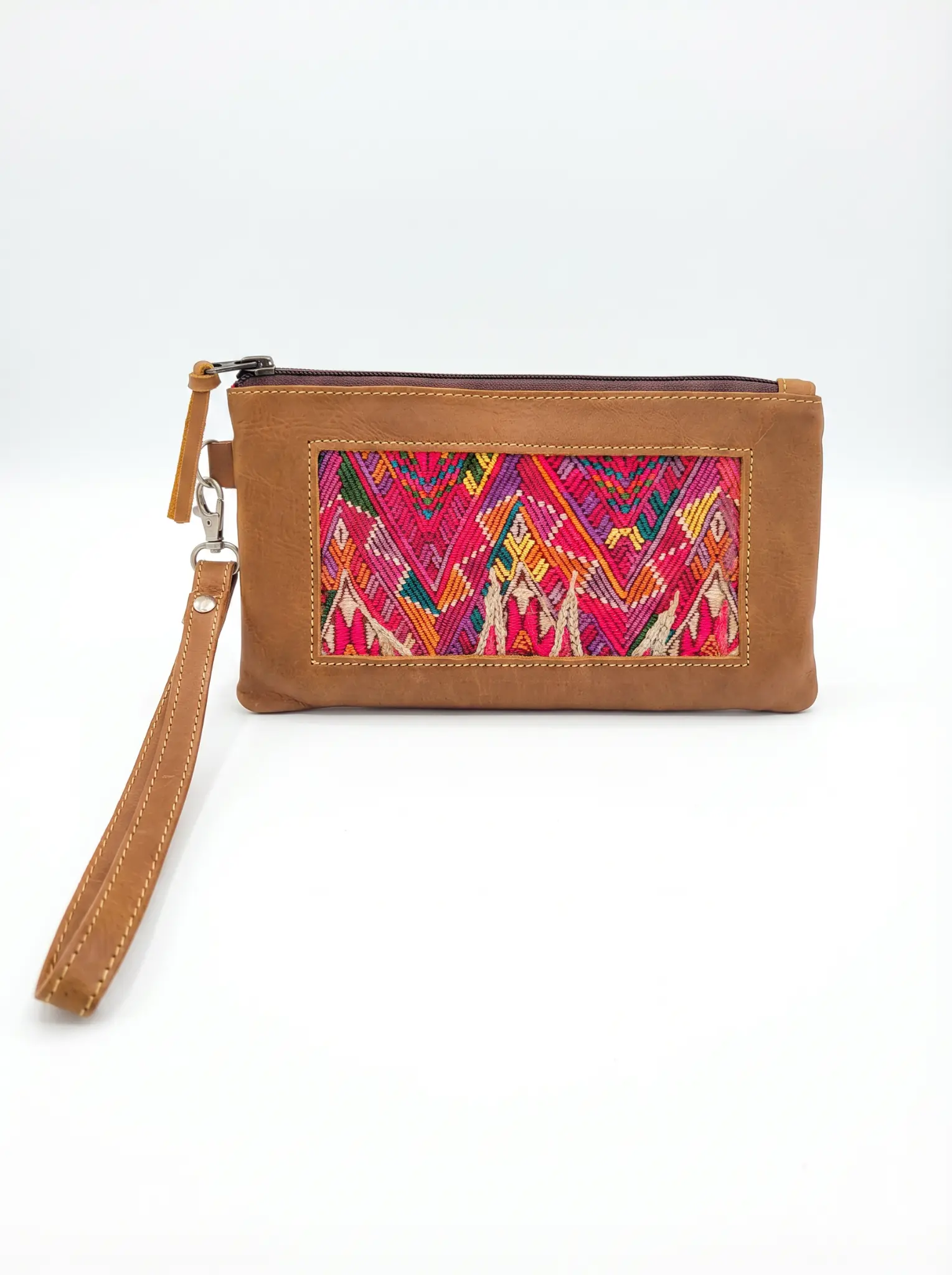 TQC wristlet clutch with vibrant pink and multicolor zigzag-triangle brocade on tan leather