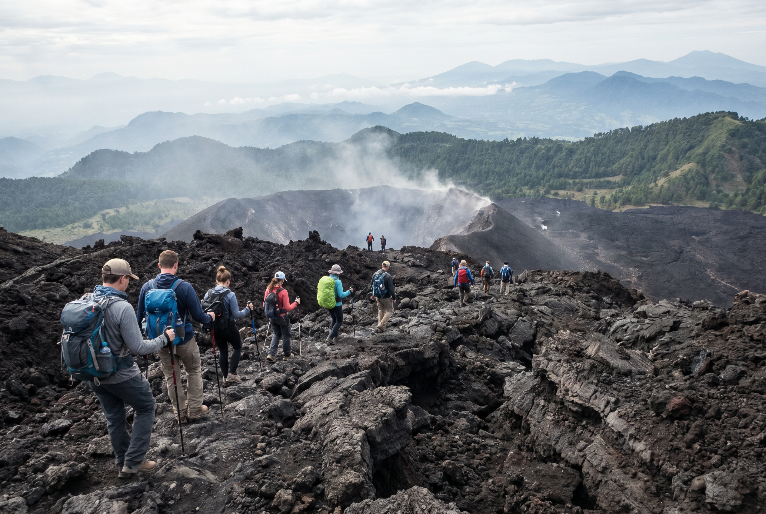 Hikers on the volcanic landscape of Pacaya Volcano with panoramic views, Guatemala.