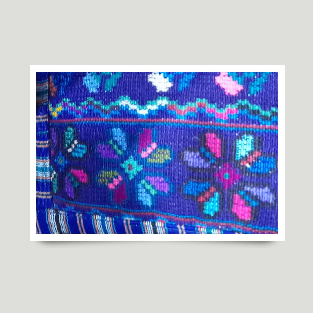 Todos Santos Cuchumatán textile featuring bold red, yellow, and blue stripes — a hallmark of regional identity