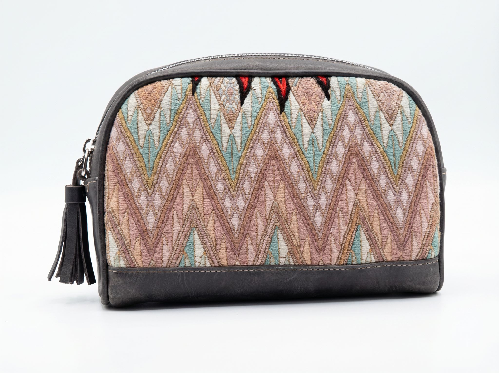 TQC dopp kit with muted pastel zigzag brocade in teal, blush, and gold on charcoal leather
